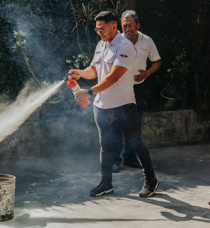 free photo of men with fire extinguisher - Provision 1 Security Solutions LLC. free photo of men with fire extinguisher
